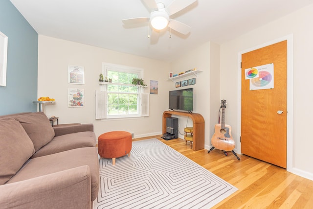 2100 Alice St, Ann Arbor, MI 48103 - living room with light wood finished floors and a ceiling fan