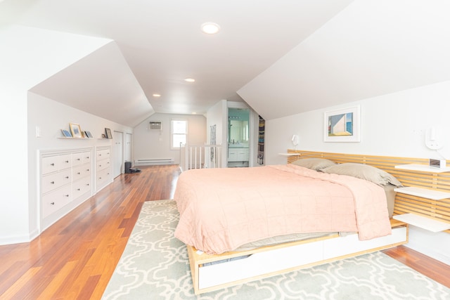2100 Alice St, Ann Arbor, MI 48103 - bedroom with a baseboard heating unit, wood finished floors, lofted ceiling, and recessed lighting