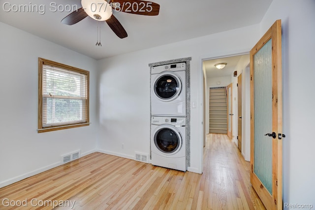923 E 4th St, Royal Oak, MI 48067 - laundry area featuring stacked washing machine and dryer, ceiling fan, and light wood-style flooring