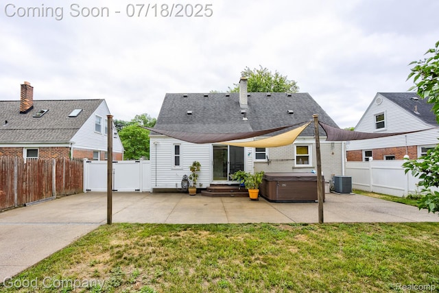 923 E 4th St, Royal Oak, MI 48067 - rear view of house with a hot tub, a patio, and a chimney
