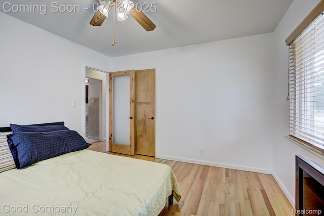 923 E 4th St, Royal Oak, MI 48067 - bedroom with light wood finished floors, multiple windows, and ceiling fan