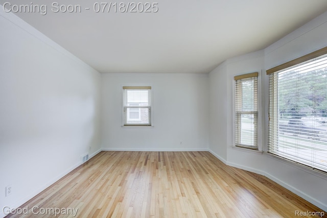 923 E 4th St, Royal Oak, MI 48067 - empty room with wood finished floors and baseboards