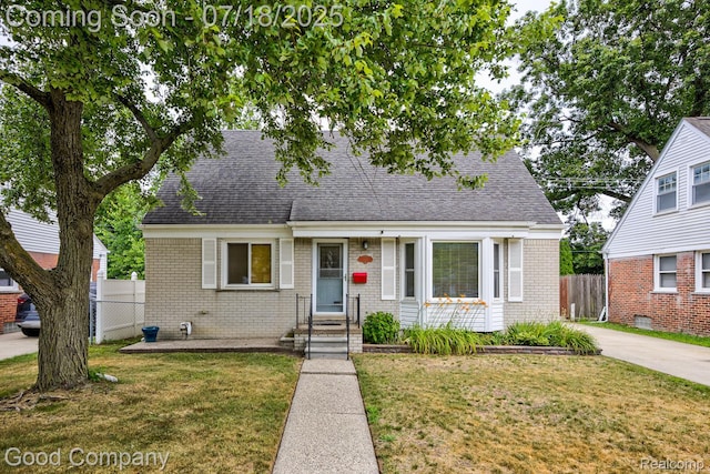 923 E 4th St, Royal Oak, MI 48067 - view of front of home with brick siding and a shingled roof