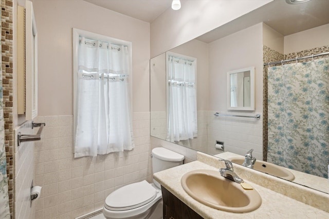 11 Geiger Ave, Battle Creek, MI 49037 - full bathroom with tile walls, vanity, wainscoting, and a shower with shower curtain