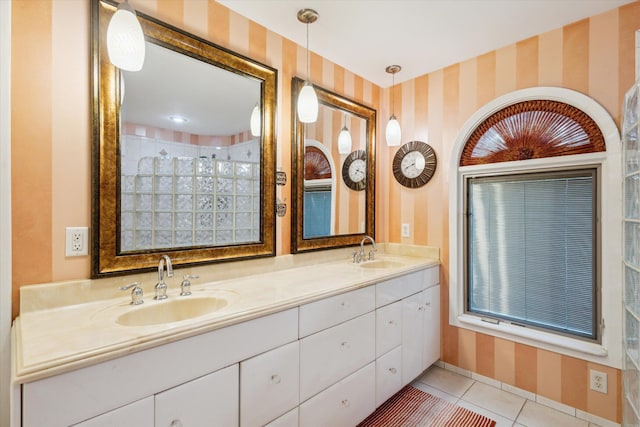 11 Geiger Ave, Battle Creek, MI 49037 - full bathroom featuring wallpapered walls, double vanity, and tile patterned floors