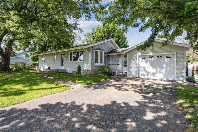 11 Geiger Ave, Battle Creek, MI 49037 - ranch-style home featuring an attached garage, driveway, and a front lawn