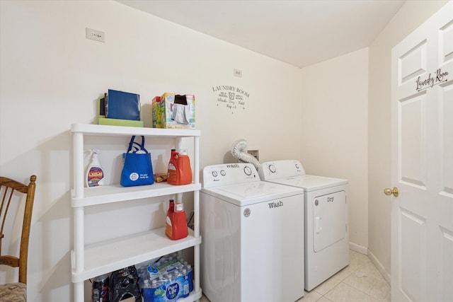 11 Geiger Ave, Battle Creek, MI 49037 - laundry room with washing machine and clothes dryer and light tile patterned floors