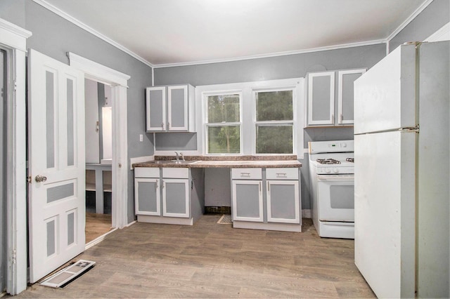 1850 S Burdick St, Kalamazoo, MI 49001 - kitchen featuring white appliances, crown molding, light wood-style flooring, and white cabinets