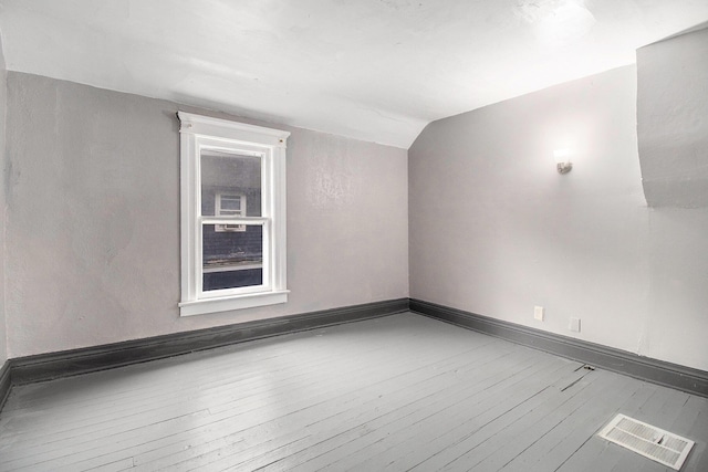 1850 S Burdick St, Kalamazoo, MI 49001 - spare room featuring hardwood / wood-style flooring and lofted ceiling
