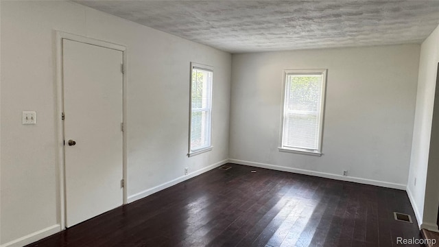 71 Cloveridge Dr, Troy, MI 48084 - unfurnished room featuring dark wood-style floors and a textured ceiling