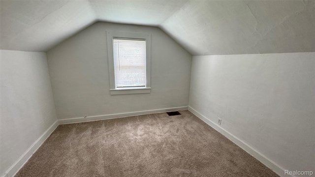 71 Cloveridge Dr, Troy, MI 48084 - additional living space featuring vaulted ceiling and carpet flooring