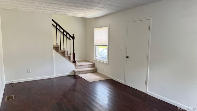 71 Cloveridge Dr, Troy, MI 48084 - foyer featuring stairs, hardwood / wood-style flooring, and a textured ceiling