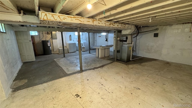 71 Cloveridge Dr, Troy, MI 48084 - basement with electric water heater and washing machine and clothes dryer