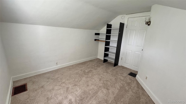 71 Cloveridge Dr, Troy, MI 48084 - unfurnished bedroom featuring vaulted ceiling and carpet