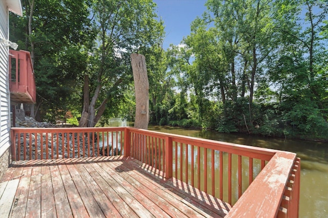 222 E Mill St, Hastings, MI 49058 - wooden terrace with a water view and view of wooded area
