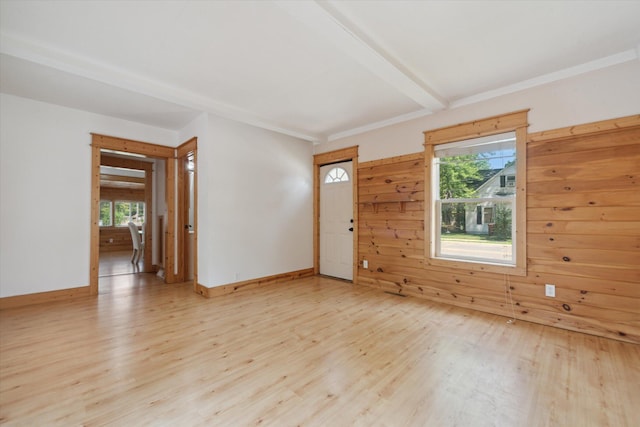 222 E Mill St, Hastings, MI 49058 - empty room featuring wood finished floors and wood walls