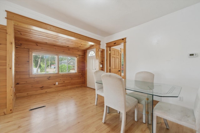 222 E Mill St, Hastings, MI 49058 - dining area featuring light wood finished floors and wooden walls