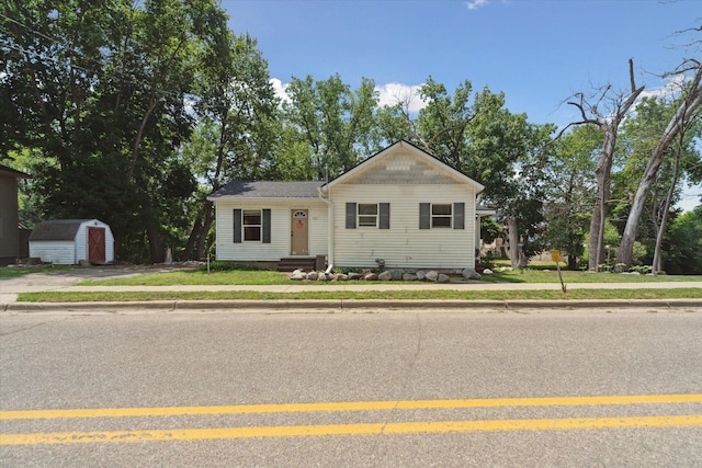 222 E Mill St, Hastings, MI 49058 - bungalow-style house with a storage unit and a front lawn