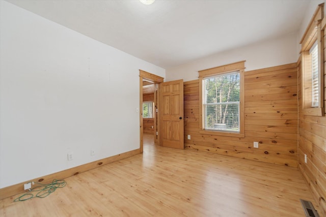 222 E Mill St, Hastings, MI 49058 - unfurnished room with wood finished floors and wood walls