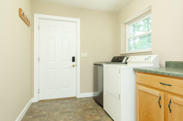 1803 Bell Rd, Niles, MI 49120 - washroom featuring washing machine and clothes dryer, cabinet space, and stone finish floors