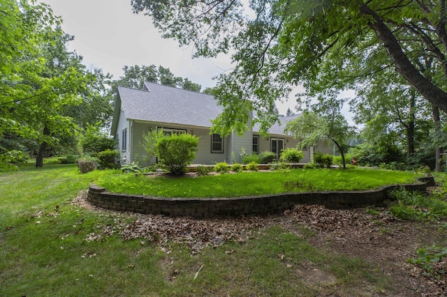 1803 Bell Rd, Niles, MI 49120 - back of property featuring a lawn and a shingled roof