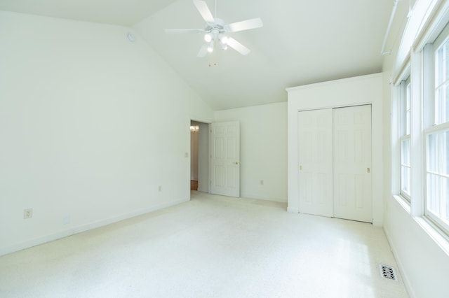 1803 Bell Rd, Niles, MI 49120 - unfurnished bedroom featuring a closet, multiple windows, ceiling fan, and high vaulted ceiling