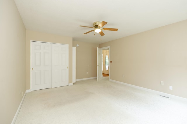 1803 Bell Rd, Niles, MI 49120 - unfurnished bedroom with light carpet, a closet, and ceiling fan