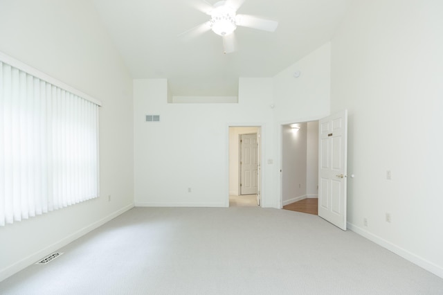 1803 Bell Rd, Niles, MI 49120 - spare room with high vaulted ceiling, light carpet, and ceiling fan