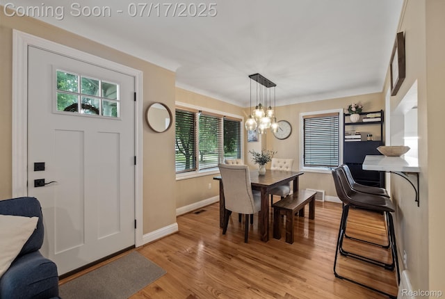 309 S Dorchester Ave, Royal Oak, MI 48067 - dining room featuring a chandelier and light wood-style flooring