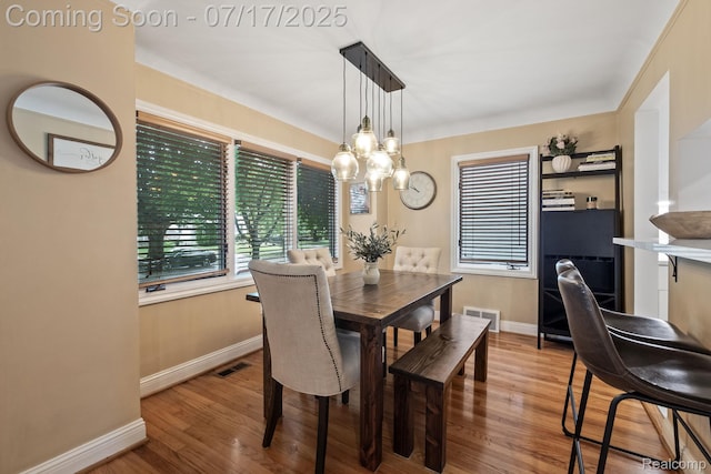 309 S Dorchester Ave, Royal Oak, MI 48067 - dining area with healthy amount of natural light, wood finished floors, and a chandelier