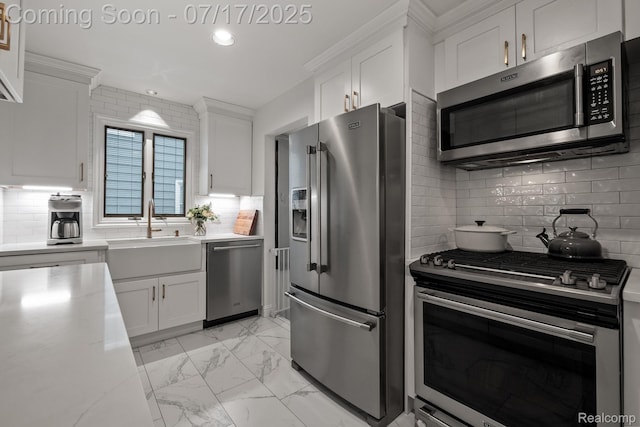 309 S Dorchester Ave, Royal Oak, MI 48067 - kitchen with appliances with stainless steel finishes, decorative backsplash, white cabinetry, recessed lighting, and light countertops