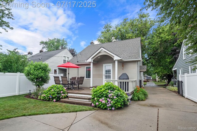 309 S Dorchester Ave, Royal Oak, MI 48067 - bungalow-style house with a shingled roof, outdoor dining area, a deck, and driveway