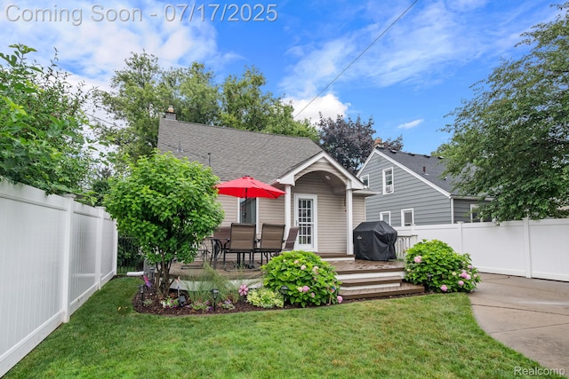 309 S Dorchester Ave, Royal Oak, MI 48067 - view of front facade featuring a fenced backyard, a wooden deck, a shingled roof, and a chimney