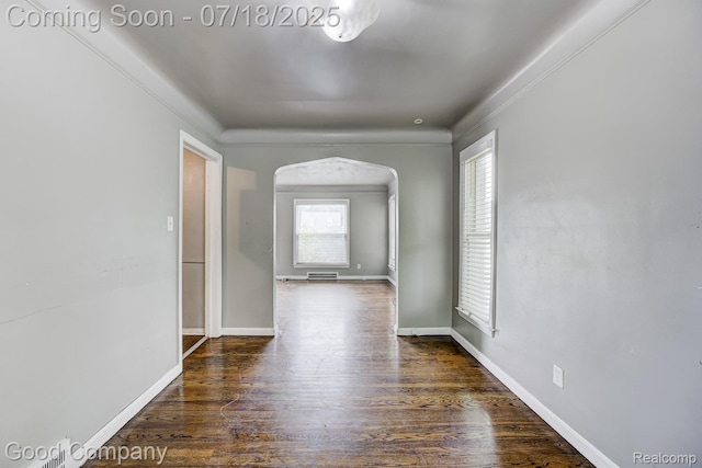 21797 Moross Rd, Grosse Pointe, MI 48236 - unfurnished room featuring arched walkways and dark wood-type flooring