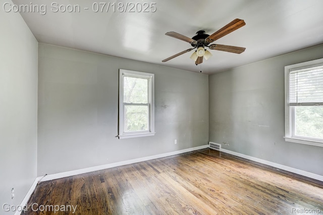 21797 Moross Rd, Grosse Pointe, MI 48236 - empty room with healthy amount of natural light, wood finished floors, and a ceiling fan