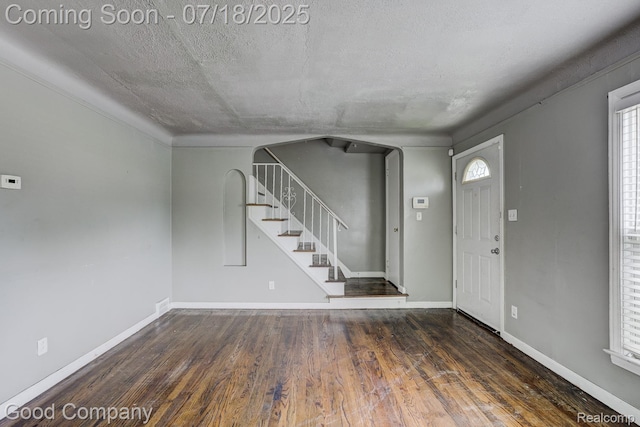 21797 Moross Rd, Grosse Pointe, MI 48236 - foyer with stairs, wood finished floors, and a textured ceiling