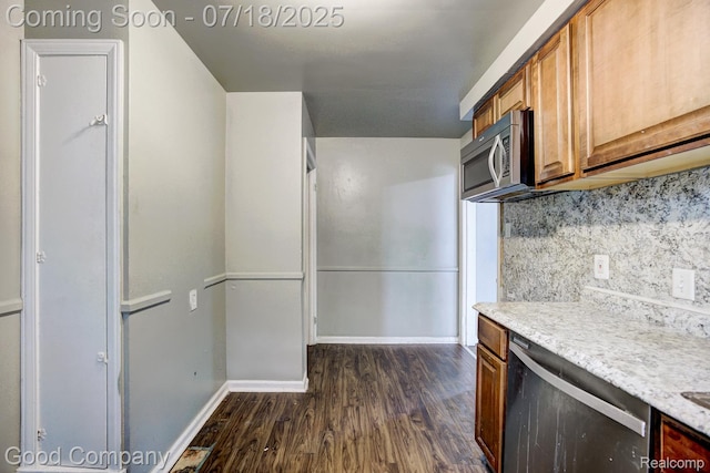 21797 Moross Rd, Grosse Pointe, MI 48236 - kitchen with appliances with stainless steel finishes, dark wood-style floors, brown cabinetry, and tasteful backsplash