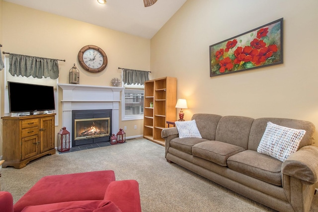 3542 Kirkaldy Cir, Portage, MI 49024 - living area featuring carpet, a fireplace with flush hearth, ceiling fan, and high vaulted ceiling