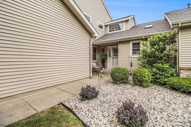 3542 Kirkaldy Cir, Portage, MI 49024 - entrance to property featuring a patio area and roof with shingles