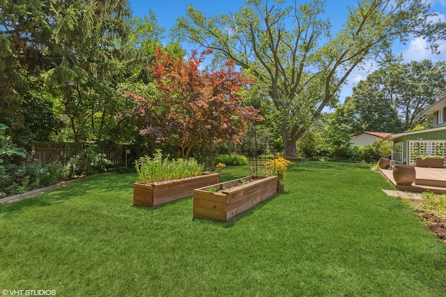 1320 S Manor Dr, Saint Joseph, MI 49085 - fenced backyard with a vegetable garden