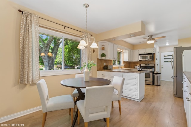 1320 S Manor Dr, Saint Joseph, MI 49085 - dining space featuring light wood-style floors and ceiling fan