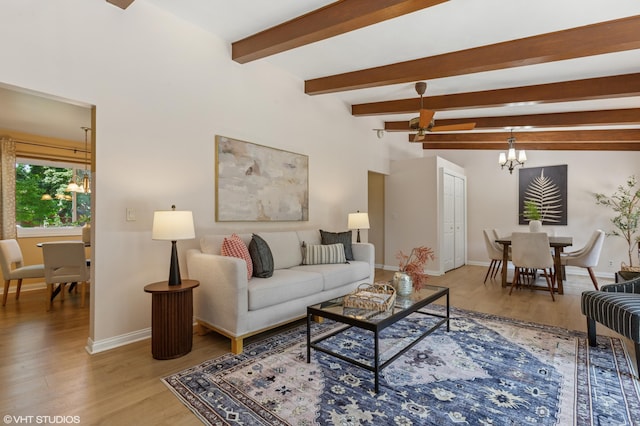 1320 S Manor Dr, Saint Joseph, MI 49085 - living room with a chandelier, light wood-style floors, and beamed ceiling