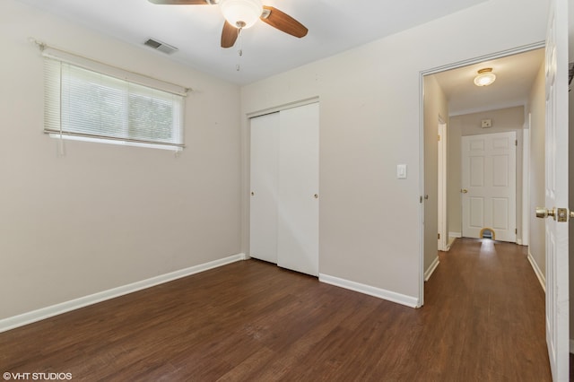 1320 S Manor Dr, Saint Joseph, MI 49085 - unfurnished bedroom featuring wood finished floors, a closet, and a ceiling fan