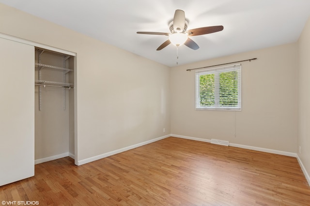 1320 S Manor Dr, Saint Joseph, MI 49085 - unfurnished bedroom featuring light wood-style floors, a closet, and ceiling fan