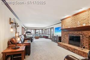 402 Thomas Ln, Grand Blanc, MI 48439 - carpeted living room featuring ornamental molding and a brick fireplace
