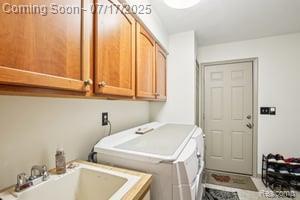 402 Thomas Ln, Grand Blanc, MI 48439 - washroom featuring cabinet space and separate washer and dryer