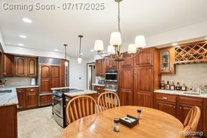 402 Thomas Ln, Grand Blanc, MI 48439 - dining area with recessed lighting and bar area