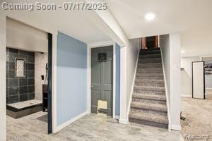 402 Thomas Ln, Grand Blanc, MI 48439 - staircase featuring baseboards