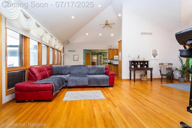 8808 Big Lake Rd, Clarkston, MI 48346 - living area featuring a ceiling fan, light wood-style floors, recessed lighting, and high vaulted ceiling