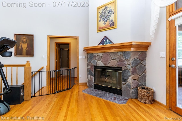 8808 Big Lake Rd, Clarkston, MI 48346 - living area with wood finished floors and a fireplace